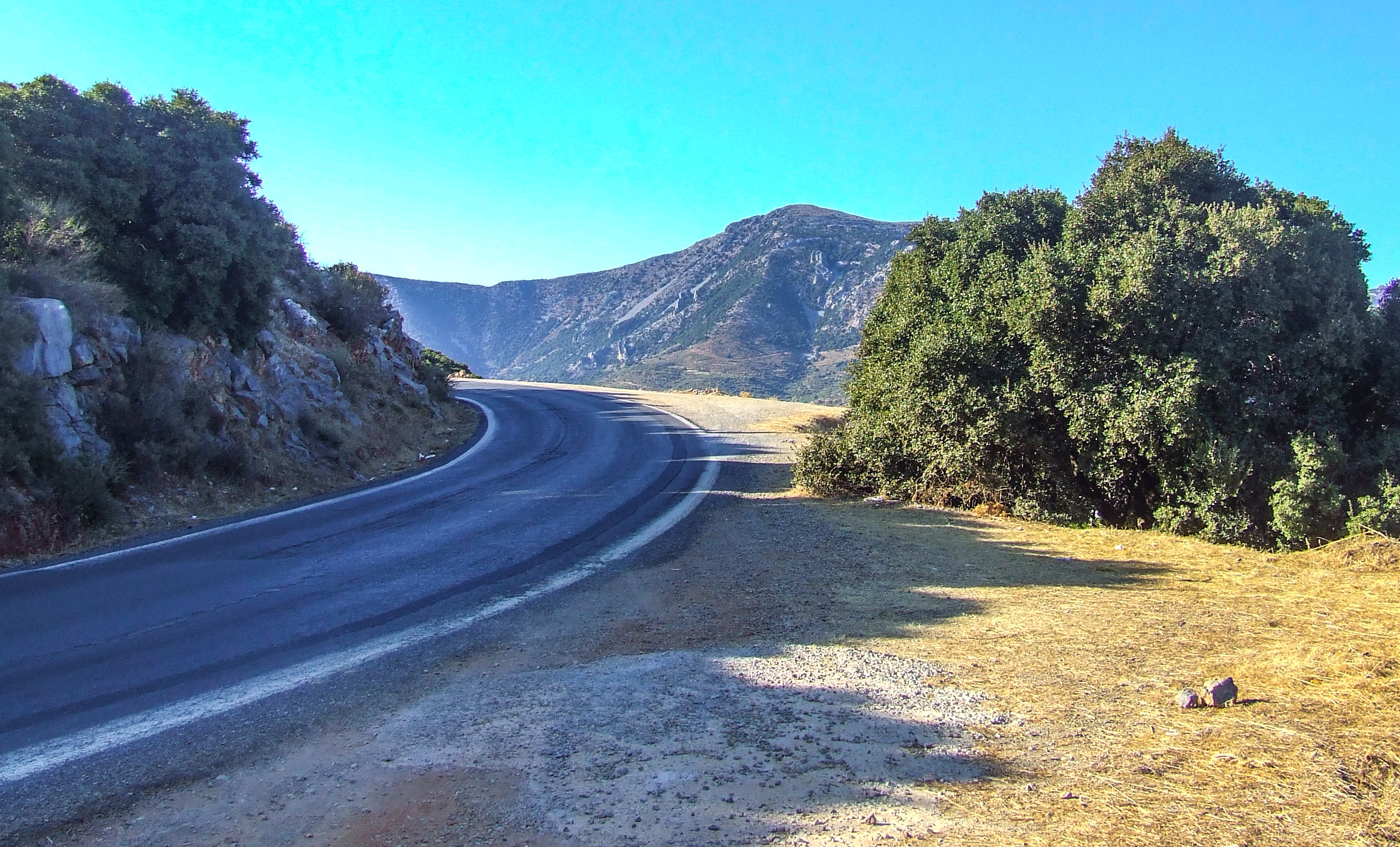 a winding road in a mountainous area